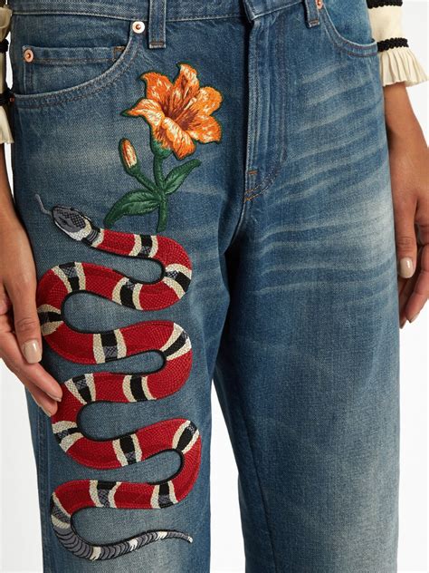 snake gucci jeans|Gucci ripped denim jeans.